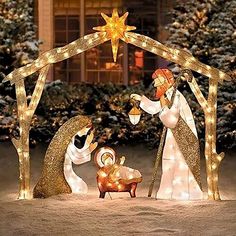 lighted nativity scene with three wise men and baby jesus