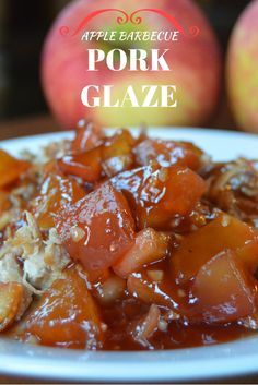 a white plate topped with apples and pork glaze