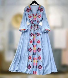 Embrace the spring-summer charm with this French sweet dress. Featuring a V-neck, delicate embroidery, drawstring waist, and a wide swing silhouette for a retro ethnic allure. One size: Length 48.4 inches (123 cm) Bust 38.6 inches (98 cm) Sleeve 18.1 inches (46 cm) Waist 34.6 inches (88 cm) **Additional Notes** - Production Variance: There may be a deviation of 0.39-1.18 inches (1-3 cm) due to different production batches. Please allow for this variability. - Size Comparison: If you are unsure a Summer V-neck Dress With Geometric Embroidery, Spring Festival Embroidered V-neck Dress, Spring Bohemian Maxi Dress With Drawstring, Bohemian Spring Maxi Dress With Drawstring, Bohemian Maxi Dress With Drawstring For Spring, Bohemian V-neck Dress With Tie Waist, Embroidered Boho Dress For Beach In Spring, Embroidered Boho Dress For Beach And Spring, Spring Peasant Style Boho Beach Dress