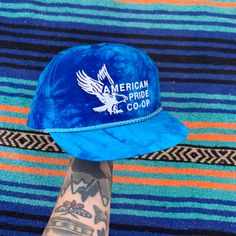 Vintage 1990's American Pride Co-Op Tie Dye Trucker Hat, Blue Eagle Snap Back Vintage Blue Snapback Baseball Cap, Vintage Blue Adjustable Baseball Cap, Vintage Adjustable Blue Baseball Cap, Vintage Blue Adjustable Trucker Hat, Vintage Blue Baseball Cap With Curved Brim, Blue Vintage Baseball Cap With Curved Brim, Vintage Blue Trucker Hat With Flat Bill, Vintage Blue Snapback Hat With Flat Bill, Retro Blue 5-panel Trucker Hat