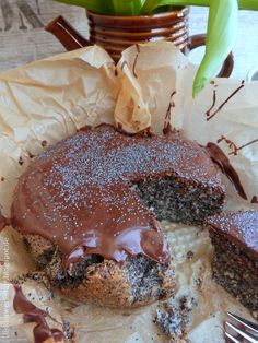 a piece of cake with chocolate frosting is on the table next to a fork