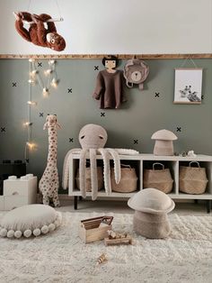 a baby's room with stuffed animals and toys