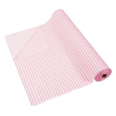 a pink and white checkered cloth rolled up on top of a roll of paper