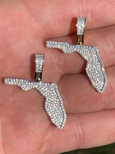 "Men's or Women's Iced Out Florida pendant! Rep Florida with this pendant! listing is for pendant only, chains sold separately Fits chains up to 3mm thick...will not fit on thicker chains than that SUPER ICY! Solid 925 sterling silver...never turns green This is a lifetime piece 1\" by 1\" - 1.5\" w bale Weighs 4.6 grams 14k gold option has real yellow gold bonded to natural silver Very detailed 3-D micropave design High grade super icy CZ stones!" Sterling Silver Bling Pendant Jewelry, Iced Out White Pendant Jewelry, Iced Out Pendant Jewelry For Anniversary, Diamond Necklace Gold, Diamond Ice, Diamond Tester, Gold Bond, Man Made Diamonds, State Of Florida