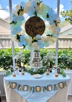 a baby is brewing themed party with balloons