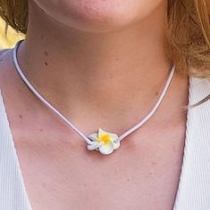 Single Strand 16 inch Pink or White Cord Choker Necklace with matching color Fimo Plumeria Flower slider pendant In stock. Shipped daily from Florida USA Adjustable White Flower Pendant Jewelry, Yellow Flower Necklace For The Beach, Yellow Flower Necklace For Beach, White Flower Charm Necklace For Beach, White Flower Charm Necklace For The Beach, White Flower Pendant Jewelry For Beach, Adjustable Yellow Flower Necklace, White Adjustable Flower Pendant Necklace, White Adjustable Flower Necklace