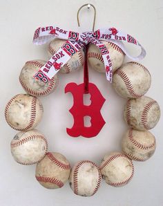 a wreath made out of baseballs with a boston red sox ornament on it