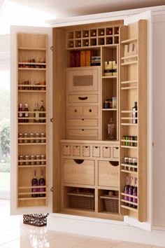 the inside of an empty pantry with drawers and baskets on it's doors is shown