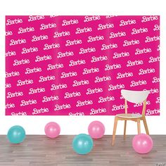 a chair and balloons in front of a pink backdrop with the words sparkle on it