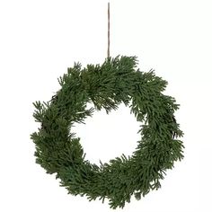 a green wreath hanging from a rope