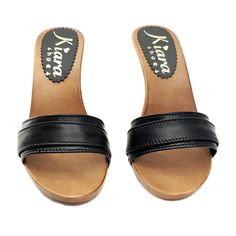 HANDMADE CLOGS Wood-effect clogs with black leather upper. Heel 9 cm. Elegant und comfortable, completely handmade in Italy. Craftsman-made. Size and LENGTH OF THE SHOE ALONG THE CURVE: 35 EU = 4 US = UK3.5 = 23.00 CM 36 EU = 5 US = UK 4 = 23.50 CM 37 EU = 6 US = UK 5 = 24.00 CM 38 EU = 7 US = UK5.5 = 24.50 CM 39 EU = 8 US = UK 6 = 25.00 CM 40 EU = 9 US = UK6.5 = 25.50 CM 41 EU = 10US = UK7.5 = 26.00 CM 42 EU = 11US = UK 8 = 26.50 CM Black Mules With Reinforced Open Heel, Black Open Heel Mules With Leather Sole, Black Wedge Heel Mules With Removable Insole, Black Mules With Wooden Block Heel, Black Closed Toe Sandals With Deep Heel Cup, Black Open Heel Mules With Wooden Heel, Black Mules With Wooden Wedge Heel, Black Open Heel Clogs With Reinforced Heel, Black Summer Clogs With Reinforced Heel