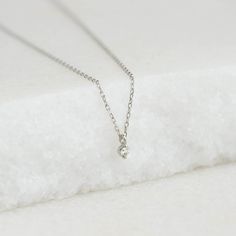 A classic round diamond pendant on a dainty chain set in 14k white gold. The Athena has a place in any woman’s wardrobe, and can make a wonderful gift for a special woman in your life.


Round lab grown diamond size: 1.7mm

0.019 total carat weight

Bezel setting

Necklace has an adjustable length and can be worn at 16", 17" and 18" Timeless Silver Diamond Necklace With Single Diamond, Timeless Silver Diamond Necklace, Delicate White Gold Solitaire Necklace With Delicate Chain, Timeless Silver Solitaire Necklace With Delicate Chain, Elegant White Gold Solitaire Necklace With Delicate Chain, White Diamond Necklace With Single Diamond In Sterling Silver, White Sterling Silver Diamond Necklace With Single Diamond, Dainty White Gold Solitaire Necklace, White Gold Solitaire Necklace With Delicate Chain For Anniversary