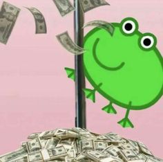 a pile of money sitting next to a pole with a frog on top of it