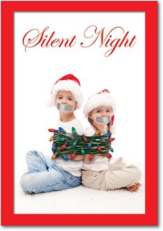 two children sitting next to each other with christmas decorations on their heads and the words silent night