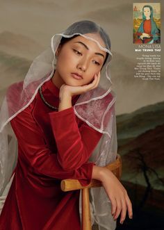 a woman wearing a veil and sitting on a chair with her hand under her chin