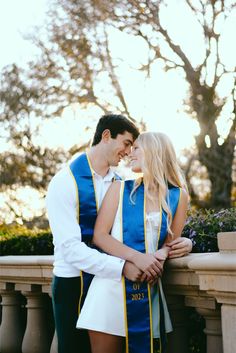 a man and woman dressed in costume hugging each other