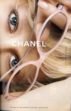 a woman with glasses on top of her head and the words chanel in front of her face