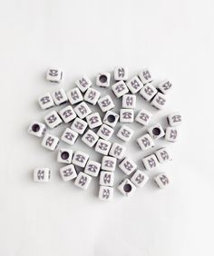 a bunch of white dices sitting on top of a table