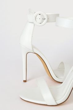 The Lulus Saylana White Ankle Strap Heels are the perfect plus one for any occasion! These sleek faux leather heels have a single sole silhouette, a slender toe strap, and a sturdy heel cup. Round covered buckle secures the ankle strap. 4" stiletto heel. Cushioned insole. Rubber sole has nonskid markings. Man made materials. Imported. Lulus | Saylana White Ankle Strap Heels | Size 11. Fitted Ankle Strap Heels With Single Strap, Single Strap Ankle Heels, Fitted Single Strap Ankle Heels, High Heel Single Strap Heels, High Heel With Single Strap, Fitted Single Strap High Heels, White Ankle Strap Heels, Faux Leather Heels, Size 11 Heels