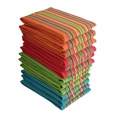 a stack of multicolored towels sitting next to each other on a white background