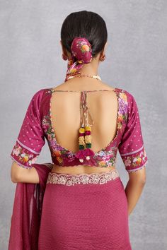 Ruby red saree blouse with floral multi-color printed motifs and tassel tie-up back.
Component: 1
Printed
Neckline: V Neck
Sleeve Length: Half
Fabric: Handwoven Chanderi, cotton silk
Color: Red
Tassel tie-up back
Plunging neck
Note: Saree worn by the model is not for sale
 - Aza Fashions Red Saree Blouse, Saree Blouses Online, Cotton Saree Blouse Designs, Cotton Saree Blouse, Backless Blouse Designs, Backless Blouse, Plunging Neck, Red Saree, Red Blouse