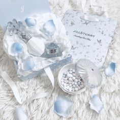 a white box filled with pearls and other items