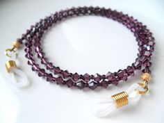 "\"GLAMOROUS!\" Crystal Eyeglass Chain in Amethyst (MORE COLORS AVAILABLE) One length: 28\" Composition: I use premium quality European crystals in beautiful amethyst color (4mm) paired with tiny Czech glass seeds in coordinating color that add a fluidity and beautiful drape to the piece. Love the result! Also available in light amethyst. I use 49 strand professional, high strength and flexible beading cable (the best on the market) in all of my designs. All GOLDplated components including fancy Purple Glasses, Eyeglass Chain Holders, Sunglasses Chain, Lanyard Necklace, Chain Lanyard, Glasses Holder, Light Amethyst, Eyeglass Chain, Eyeglass Holder