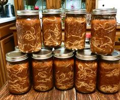 several jars filled with food sitting on top of a counter