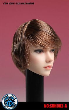 the head of a mannequin with short hair is shown in front of a pink background