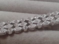 Very attractive Art Deco Revival link bracelet with multiple small round diamonds in round and marquis shaped settings. Marked spb which we believe is for silver plated brass, later 90s Y2K. B 178 Formal Silver Marquise Diamond Bracelet, Classic Silver Marquise Diamond Bracelet, Silver Marquise Diamond Cut Bracelet, Silver Diamond Marquise Bracelets, Silver Marquise Diamond Bracelet Gift, Silver Marquise Jubilee Tennis Bracelet, Silver Marquise Diamond Bracelet For Anniversary, Art Deco Revival, Art Deco Bracelet