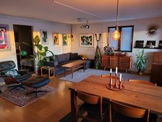 a living room filled with furniture and wooden floors