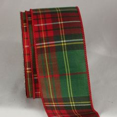 a red and green plaid tie on a white background