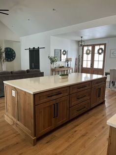 a large kitchen island sitting in the middle of a living room