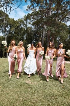 the bridesmaids are all dressed in pink dresses