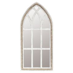 an arched window with beaded trim on the side and white frame, is shown