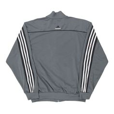 Description:Vintage grey Adidas track jacket, fits large.GENDER: mens CONDITION: good - stains on front and sleeves.STYLE: track jacketERA: 1990sCOLOUR: greyFABRIC: polyester Urban Gray Track Jacket For Streetwear, Gray Track Jacket For Streetwear In Fall, Gray Track Jacket For Fall Streetwear, Sports Outerwear With Ribbed Cuffs In Gray, Gray Athleisure Track Jacket For Streetwear, Gray Long Sleeve Sportswear Track Jacket, Gray Sportswear Track Jacket For Fall, Adidas Track Jacket, Sleeves Style