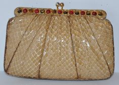 Judith Leiber's wonderfully detailed beige python evening clutch has the optional use of a evening shoulder bag with their removable straps of python and gold hardware. The evening clutch is highly detailed with tiger's eye and garnet Judith Leiber, Garnet Stone, Evening Clutch, Tiger's Eye, Tiger Eye, Python, Evening Bags, Gold Hardware, Lamp Shade