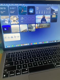 an open laptop computer sitting on top of a table