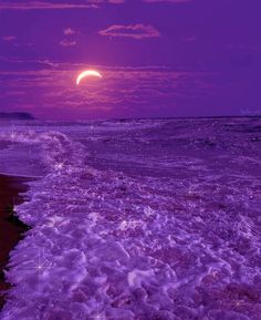 the moon is setting over the ocean with purple hues