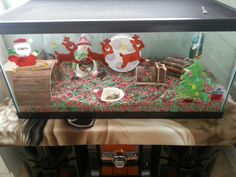 a fish tank filled with lots of christmas decorations