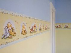 there are many pictures on the wall in this child's room that is painted