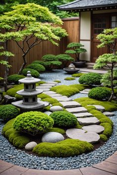 a small garden with rocks, grass and trees in the middle of it is surrounded by gravel