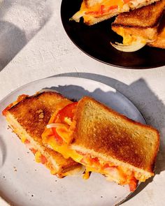 Braaibroodjie, or "barbecue bread," is a South African grilled cheese sandwich, and this version stacks cheddar, tomato, onions, and chutney.