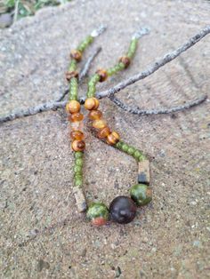 An earthy granola girl aesthetic gemstone choke; crafted with orange carnelian stones, rectangular pink feldspar, with green and pink polished unakite stones and red cherry creek jasper stone at the center.  Accented with green glass beading and natural varnished wood beading. *Handmade by me, one of a kind. *Total Length: 14 inches *Length of Chain: 12.75 inches *Extender Length: 3/4 an inch. If you require a longer extension chain to ensure a proper fit, please let me know!  Just let me know how long you would like your extension chain under personalization instructions. (free of charge) *Diameter of jasper stone: 12 mm *Diameter of unakite stones: 10 mm *Clasp and Chain Material: Lobster claw and jump rings made of stainless steel. *Strung on strong and flexible 19-strand stainless stee Whimsigoth Jewelry, Grunge Hippie, Granola Girl Aesthetic, Orange Carnelian, Gemstone Choker, Nature Necklace, Hippie Necklace, Carnelian Stone, Unique Nature