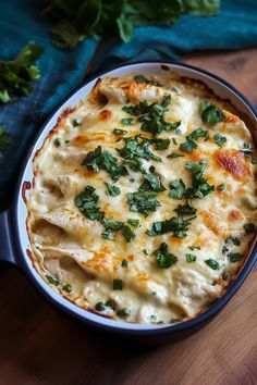 a casserole dish with cheese and herbs