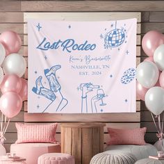 pink and white balloons are in front of a large sign that reads last rodee