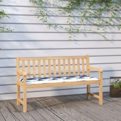 a wooden bench sitting on top of a wooden deck