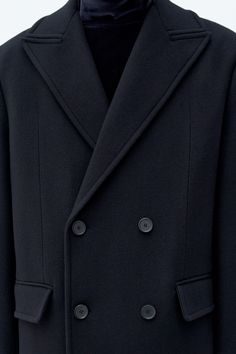 Classic Black Oversized Wool Coat, Oversized Black Wool Blazer, Black Wool Peacoat With Lapel Collar, Black Double-breasted Structured Outerwear, Black Structured Double-breasted Outerwear, Black Wool Peacoat With Notch Lapel, Classic Black Structured Outerwear, Black Tailored Peacoat For Work, Tailored Black Peacoat For Work