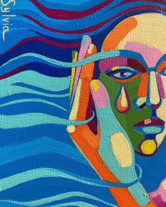 a painting of a woman's face in blue water