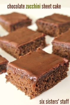 several pieces of chocolate cake on a white plate